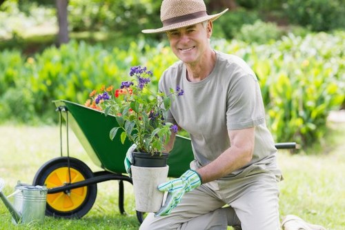 Man and van loading green waste from a terraced house hedge